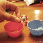 Using pom poms and cups for in hand manipulation