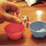 Using pom poms and cups for in hand manipulation