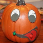 Craft Jack-O-Lantern using pins and face parts for fine motor skills
